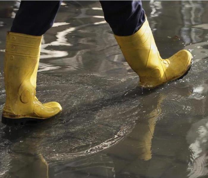 person in rubber boots